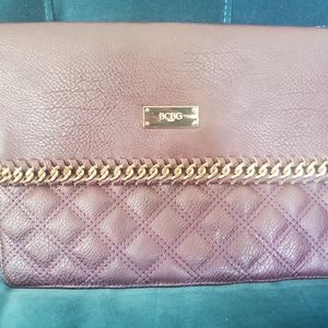 BCBG clutch with gold wrist chain